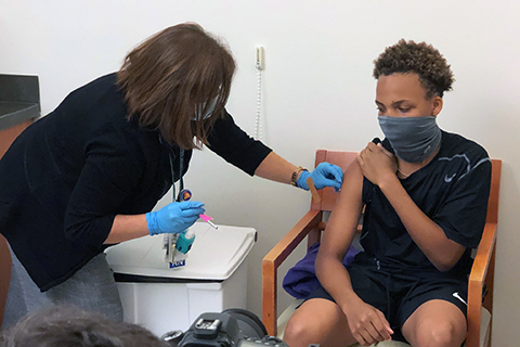 Aaron Williams receives vaccine