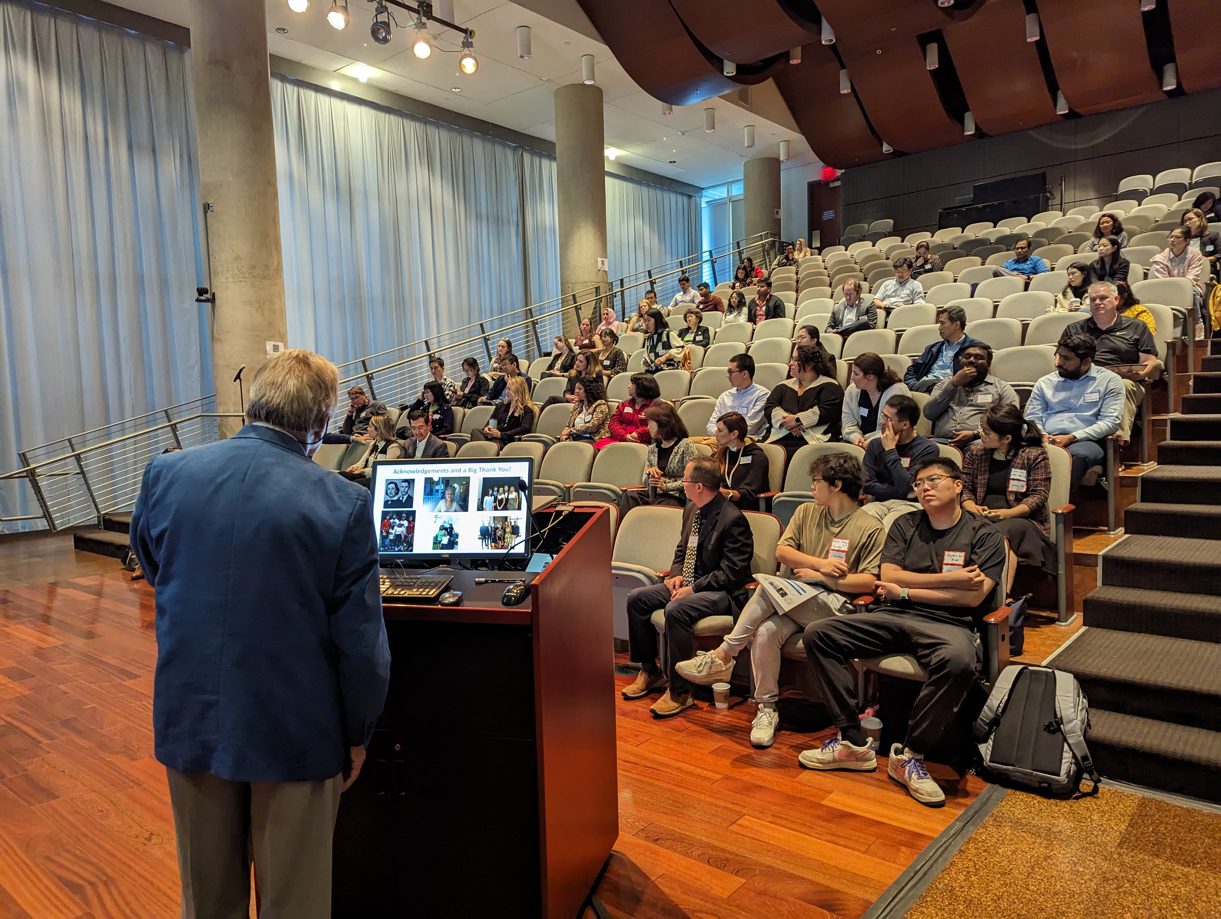 man standing behind podium