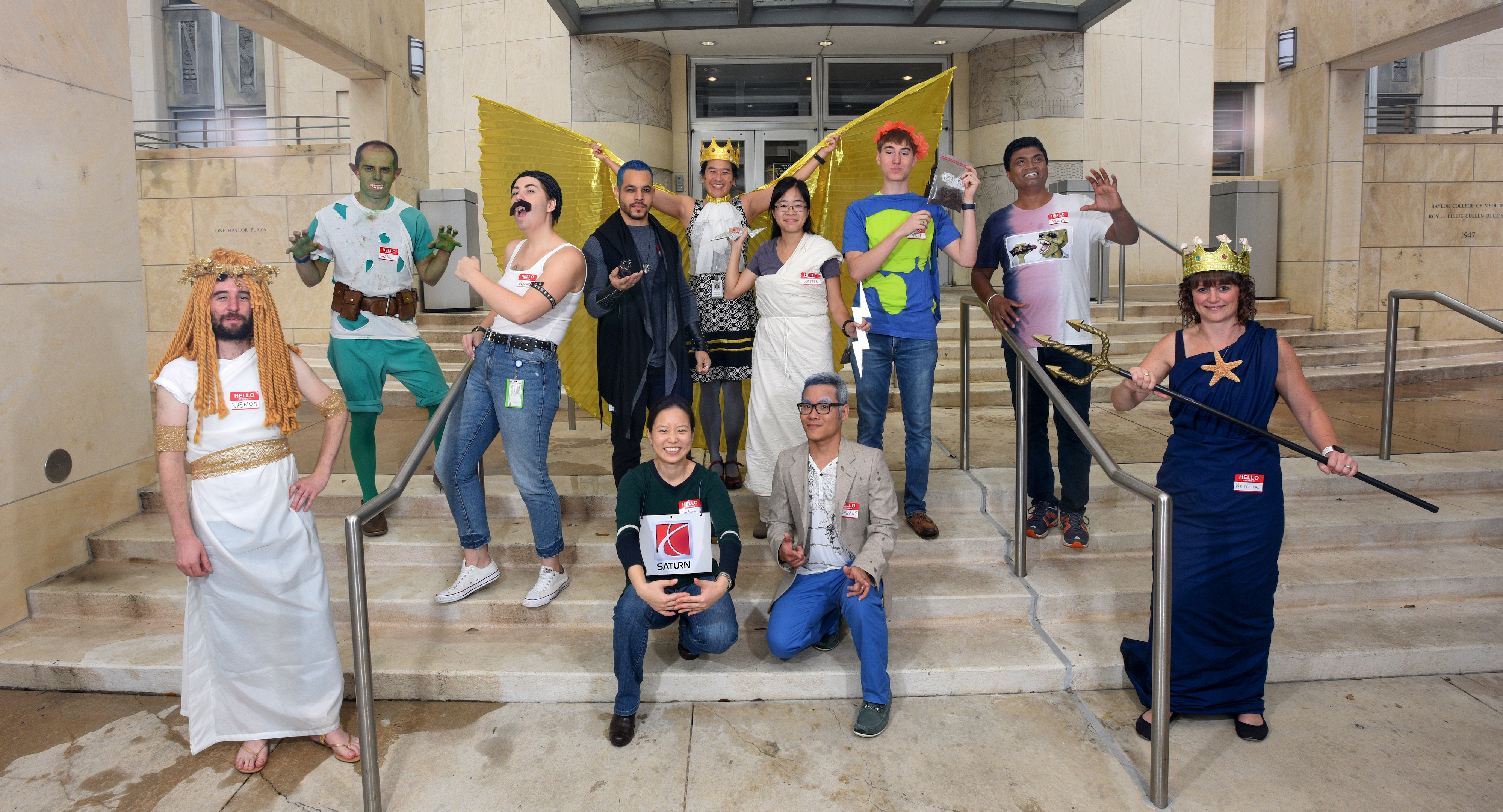 Members of the King lab dress as an abstract representation of the Solar System