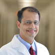 Dr.
