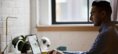 A person sitting at a desk in an office