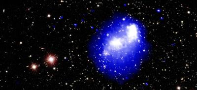 An image of deep space, with brightly colored lights against a backdrop of black void.