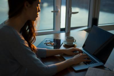 A person working at a laptop.