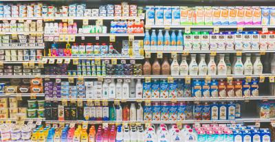Shelves full of perishable products in a grocery store.