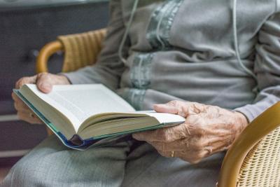 Elderly woman reading a book