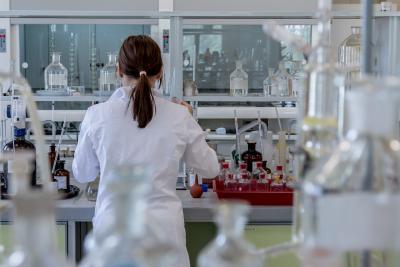 Woman in lab coat in research lab