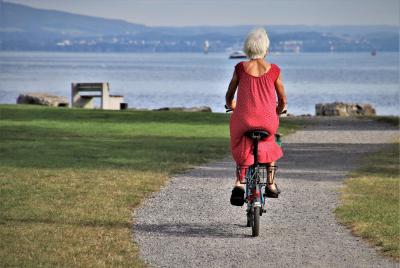 Elderly woman on bike