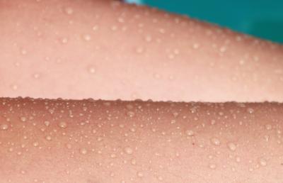 Close up photo of sweat on skin.