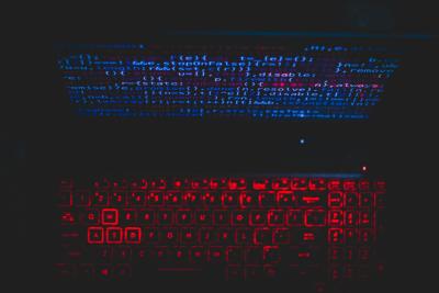 Image of a glowing computer screen and a glowing keyboard