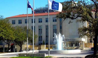 front of baylor college of medicine building with two flags