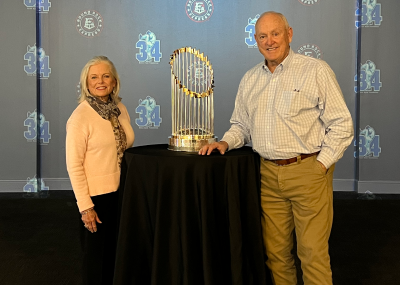 Nolan Ryan and his wife, Ruth, pose with a World Series trophy.