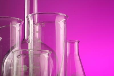 Photo of test tubes with a pink background