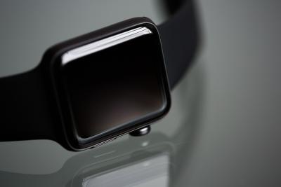 Photo of a smart watch on a black background.