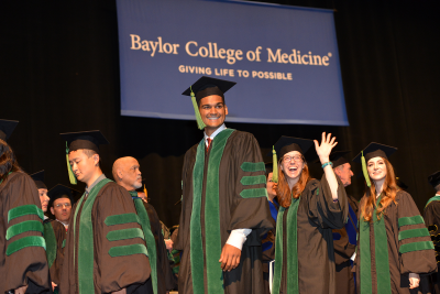 Students walk across the stage during Graduation 2017.