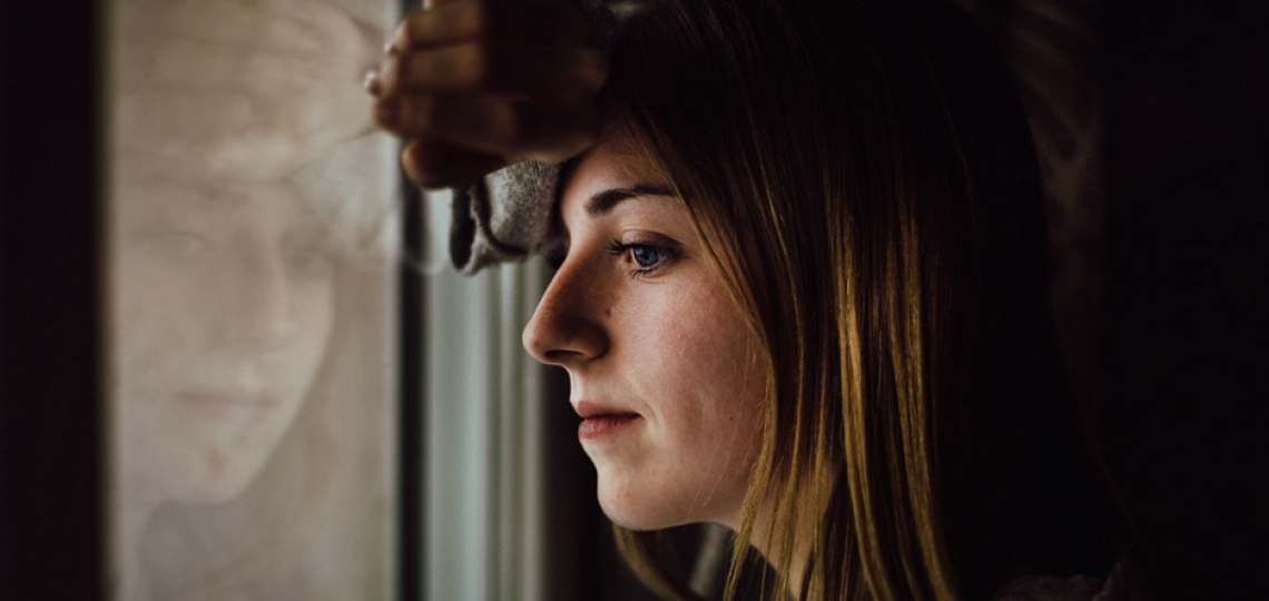 woman-looking-out-of-window