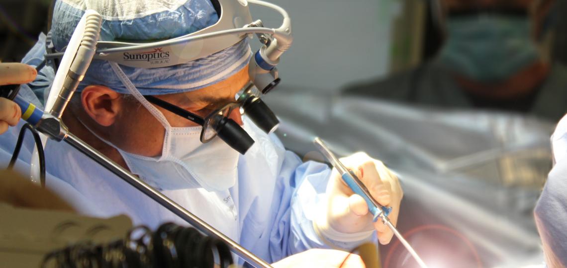 A surgeon operating
