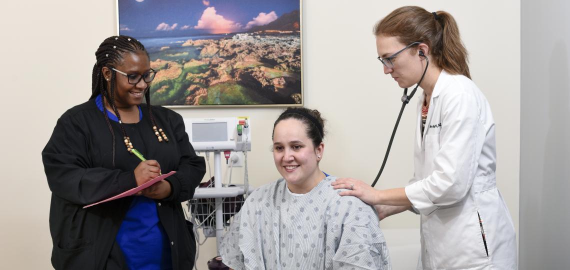 Physician and nurse with patient