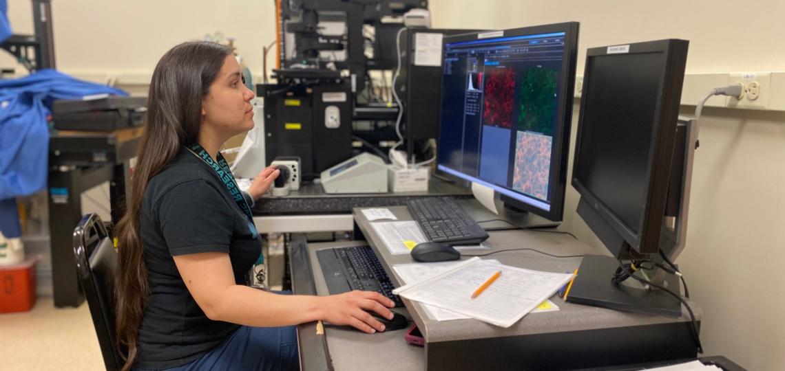 Marina Martinez-Vargas, Ph.D., analyzing images