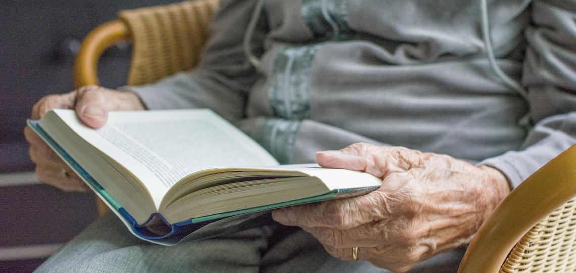 Elderly woman reading a book
