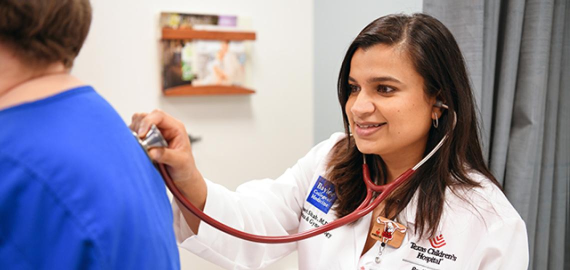 Gynecologic and Obstetrics Specialist Dr. Utsavi Shah cares for a pregnant patient during an obstetric appointment. 