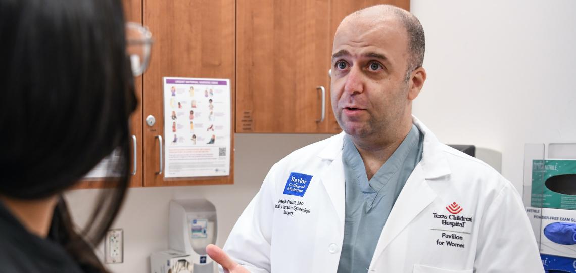 Dr. Joseph Nassif of the Center of Excellence for Minimally Invasive Gynecologic Surgery counsels a patient about her surgical options.