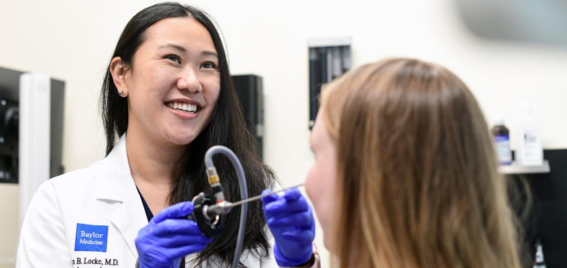 Smiling female doctor and a patient.