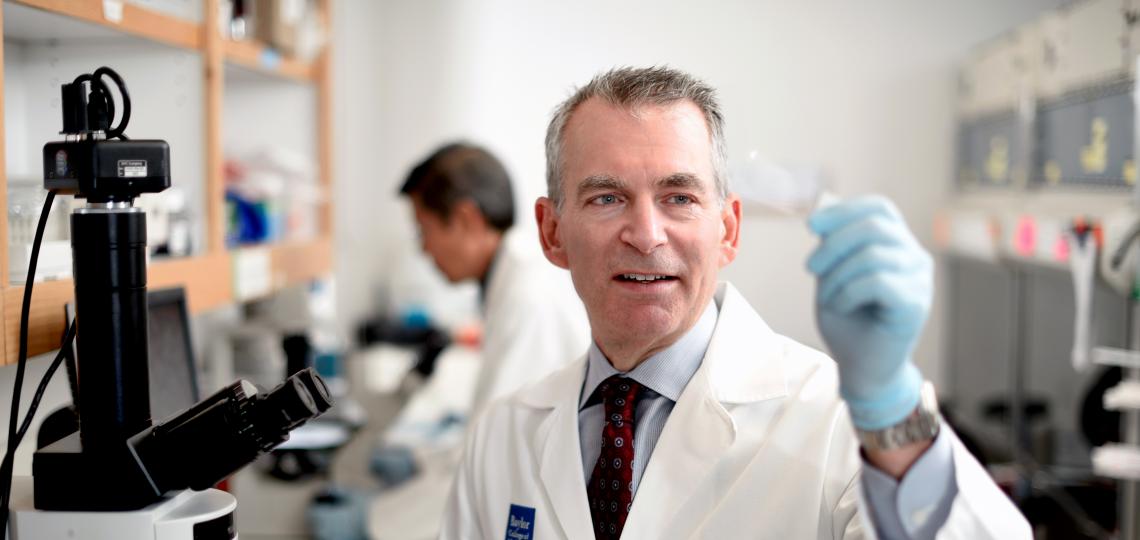 Dr. Lerner examines a sample slide.