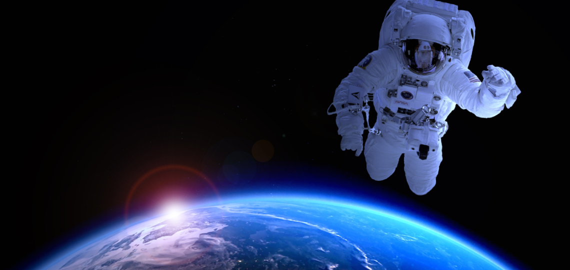 An astronaut in space above Earth