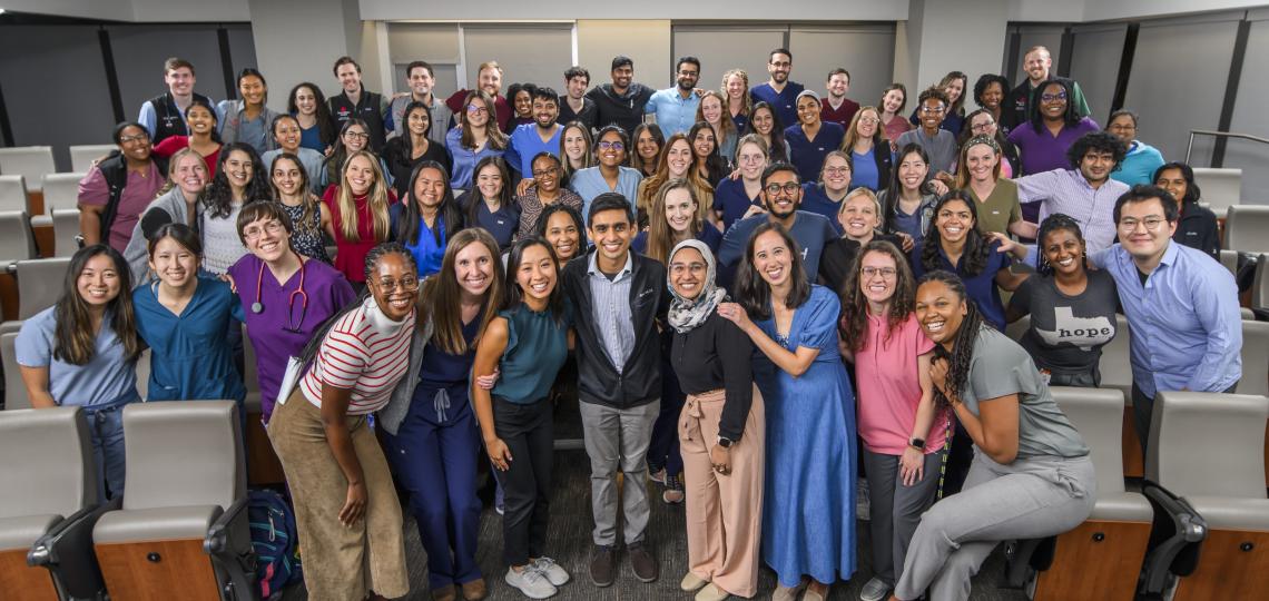 group of people smiling at camera