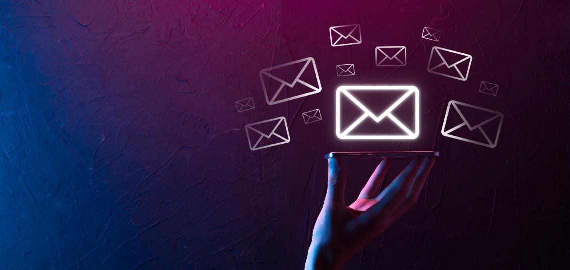 Image of human hand and envelopes.