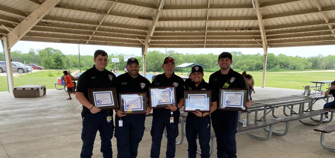EMSC Crew of the year holding their award