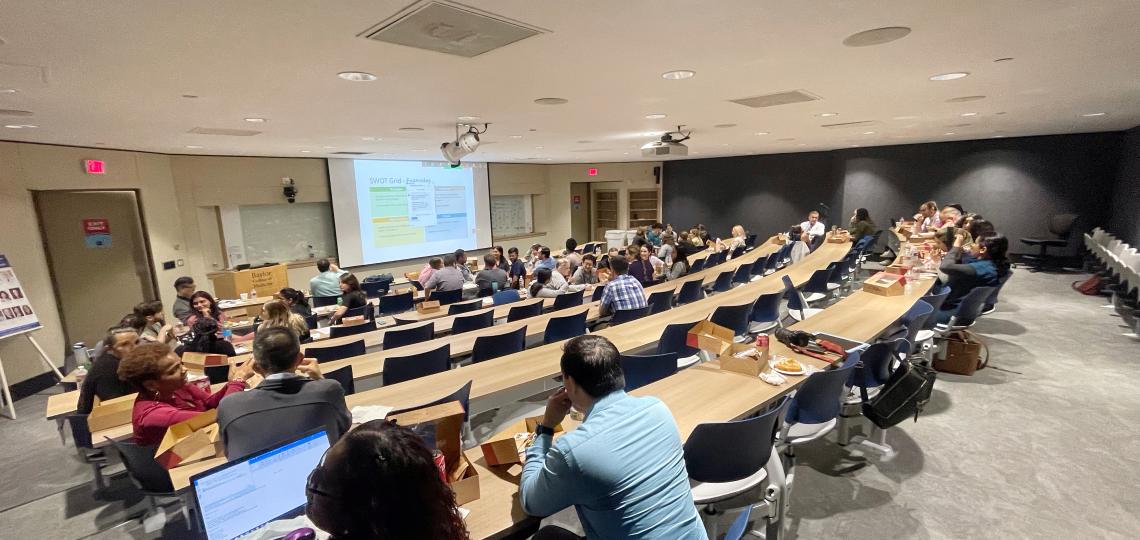 room of people looking at powerpoint