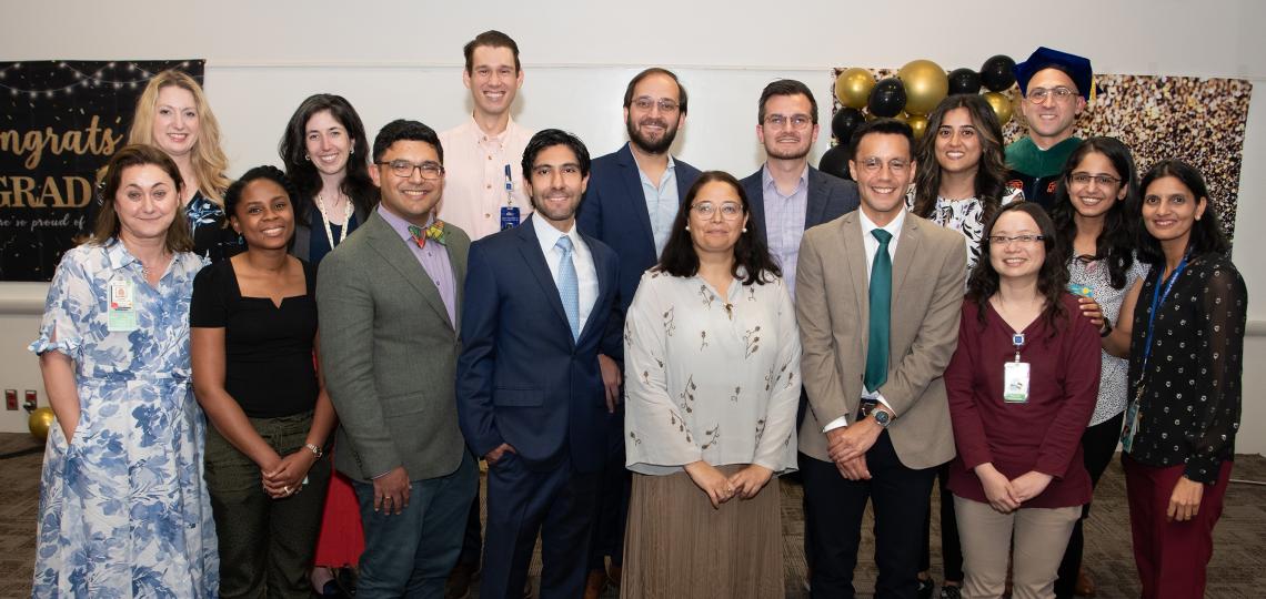 group of people in nice attire smiling