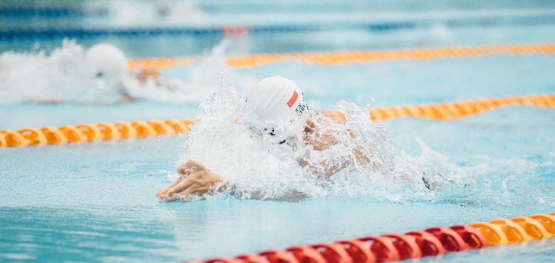 Photo of a person swimming in a race