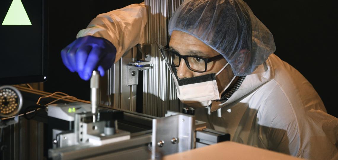 lab member looking at a sample