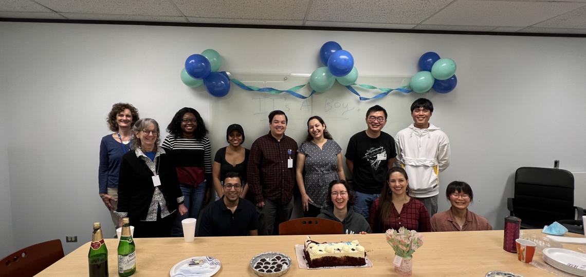 People posing at a baby shower