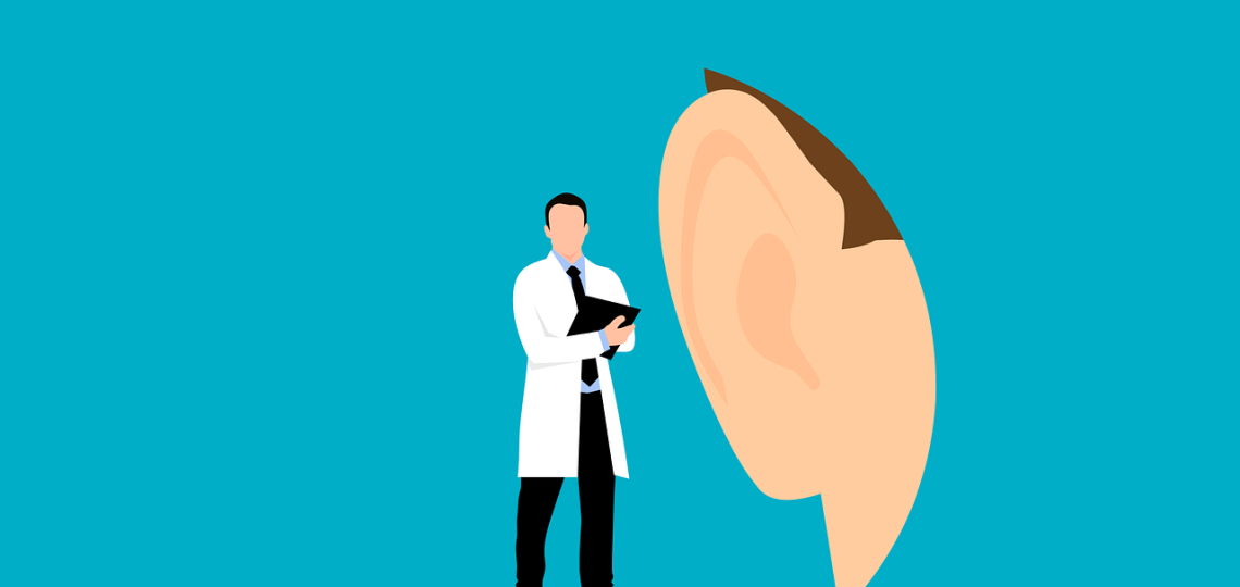 Drawing of a doctor standing next to a huge hear to represent hearing health