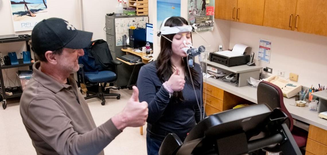 woman performing a breathing test on a treadmill