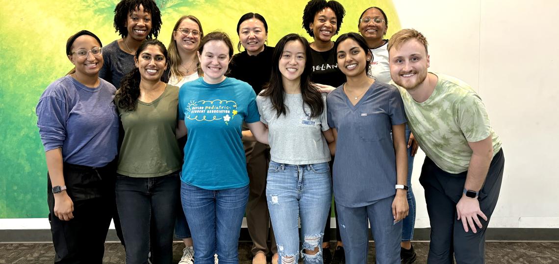 group of people smiling after volunteering at houston food bank