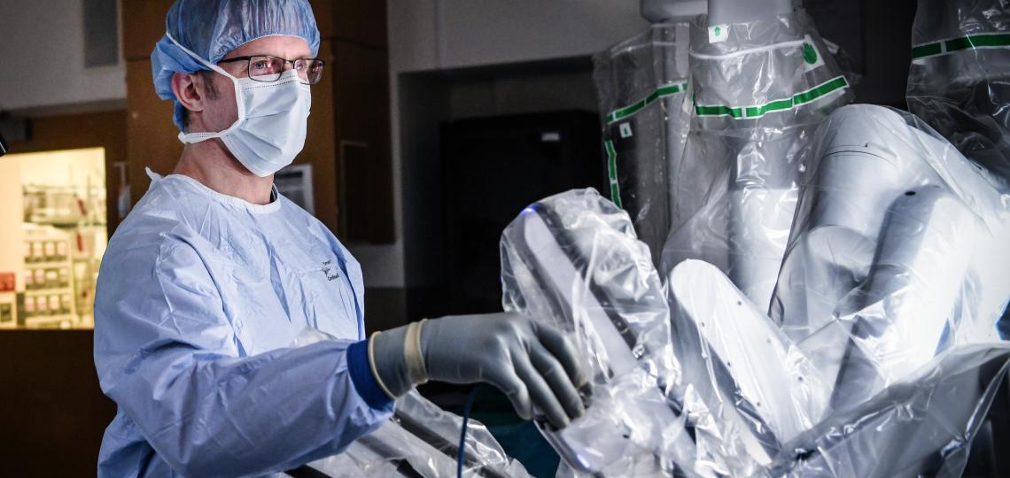 Shawn Groth, M.D. with surgical robot.
