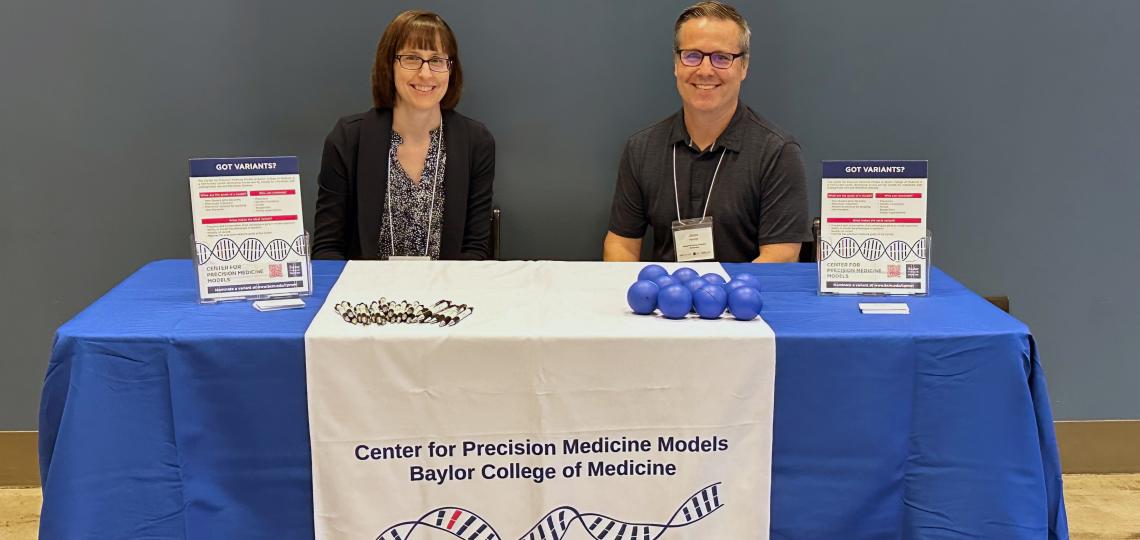 Heaney and Burrage of CPMM at their booth at the 2004 UDNF Event