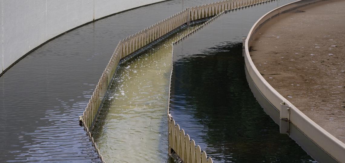 Photo of a wastewater treatment center, showing different shades of water