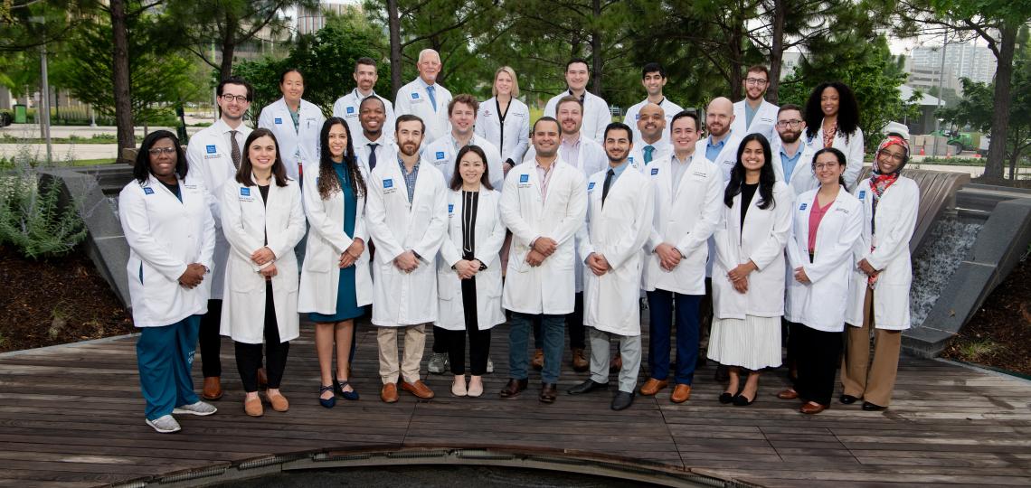 group of doctors standing outside, smiling