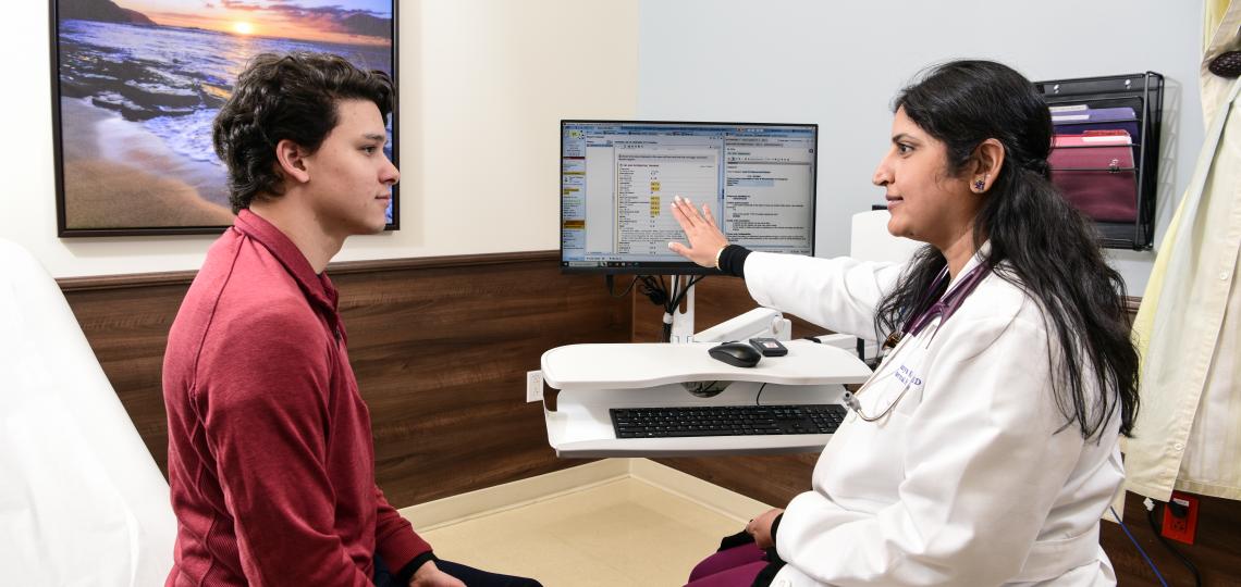 A doctor and patient discussing care options.