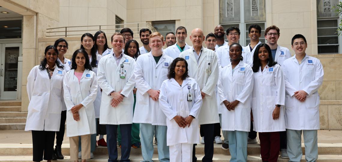 group of doctors standing on steps and smiling