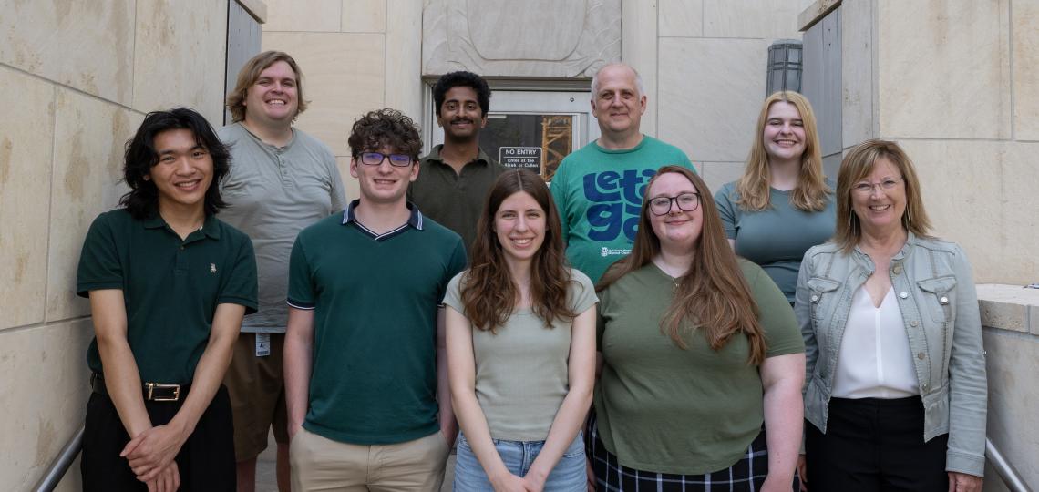 group of people standing in front of a building