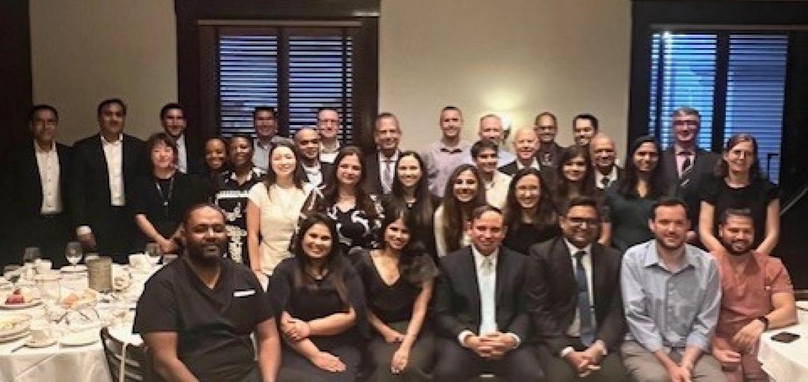 large group of people in a restaurant smiling