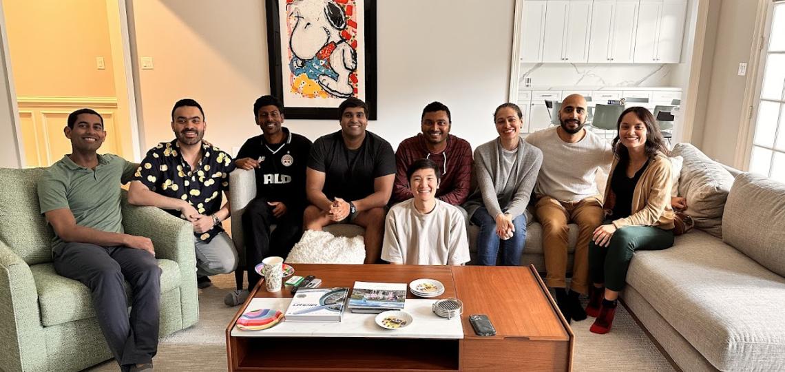 group of people sitting together smiling