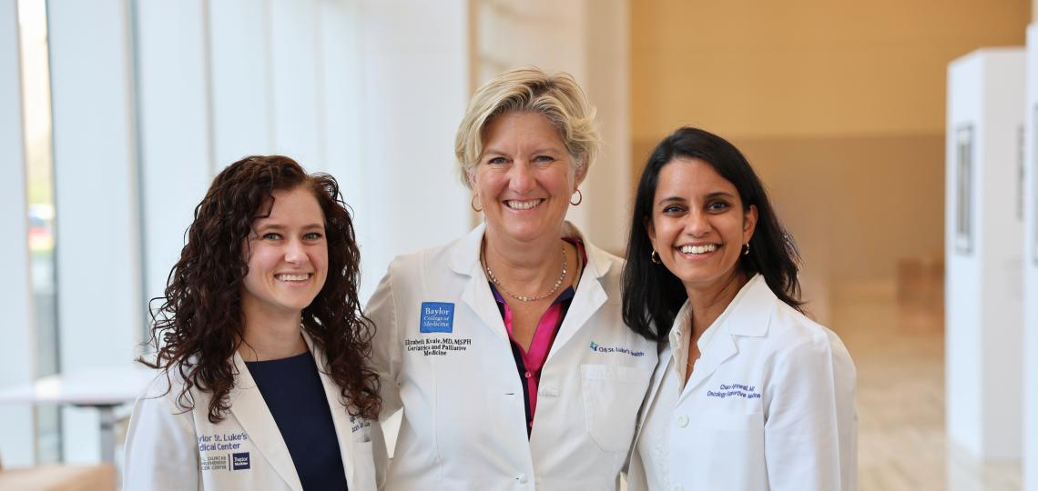 photo of three women in white coats