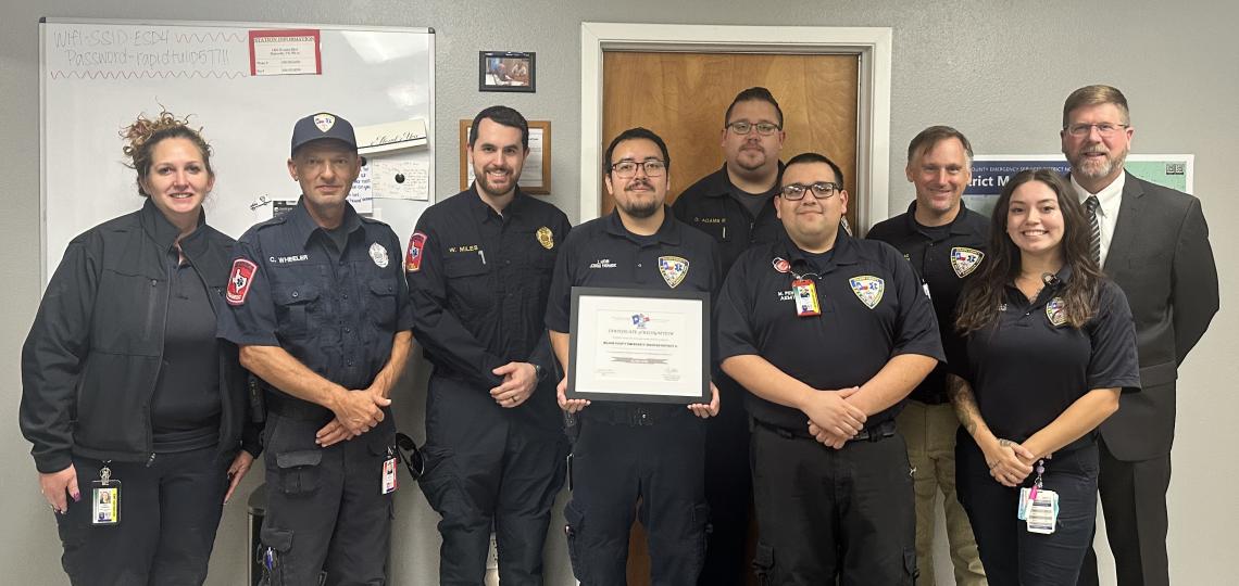 group of first responders standing in front of a wall